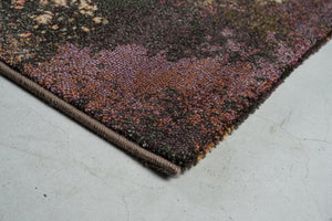 Eckdetail des Teppichs Tapison Home Torino 063.0934.7274 in Pflaume, Mauve und Olivgrün
