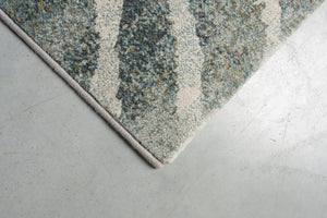 Eckdetail des Teppichs Tapison Home Torino 063.0990.4299 in Grün und Grau
