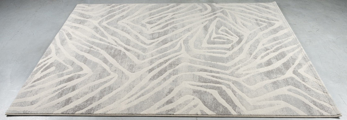 Teppich Tapison Home Torino 063.0990.6797 auf dem Boden liegend, schräg gesehen