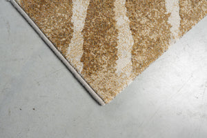 Eckdetail des Teppichs Tapison Home Torino 063.0990.7299 in Ocker und Elfenbein