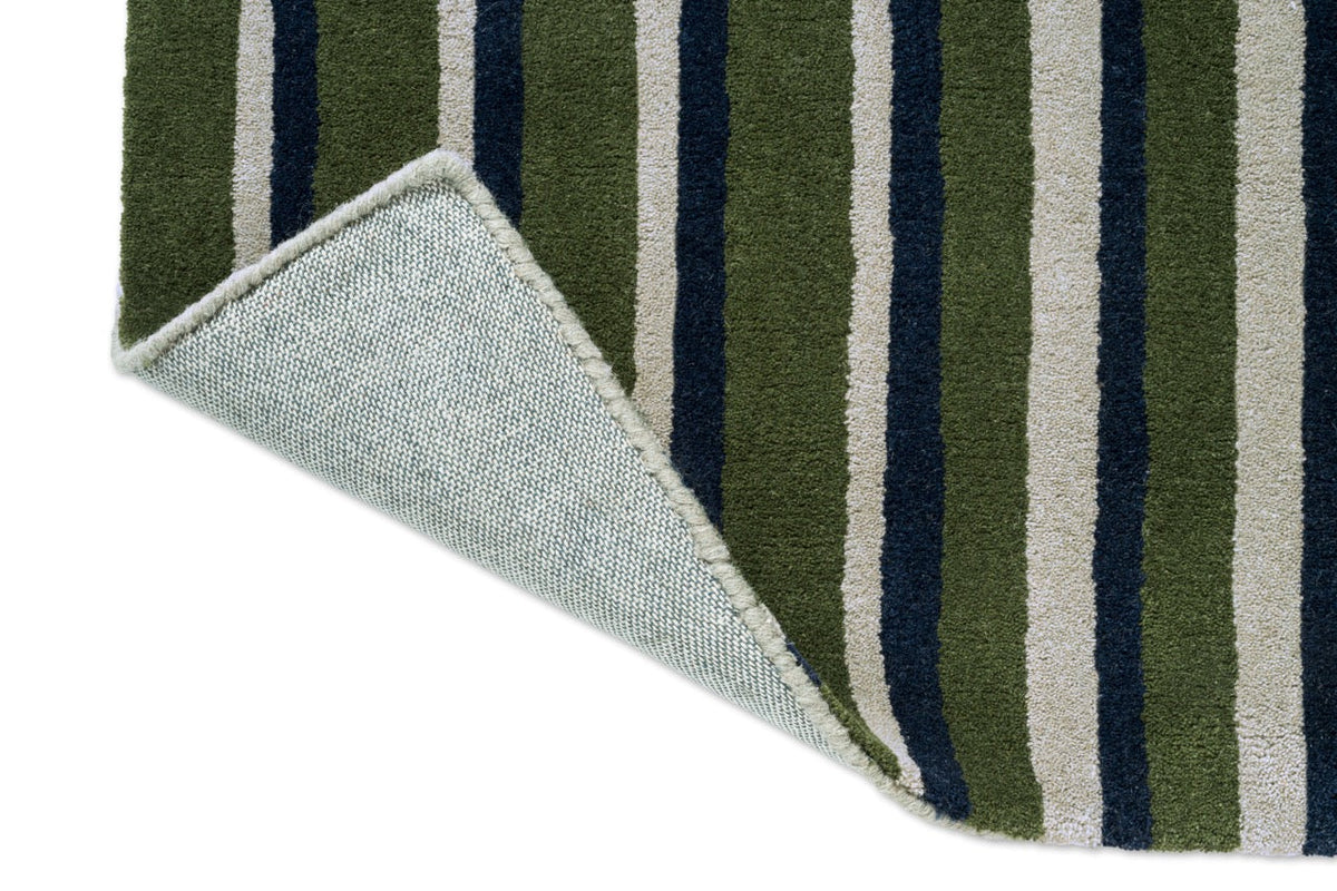 Brink & Campman Decor Pilar Moss Teppich, Detail von umgeschlagener Ecke und Rücken