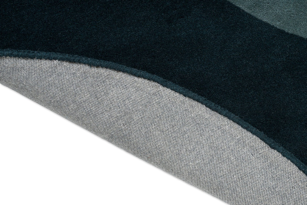 Brink & Campman Element Lane Blue Teppich, Detail von umgeschlagener Kante und Rücken