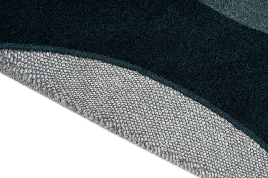 Brink & Campman Element Lane Blue Teppich, Detail von umgeschlagener Kante und Rücken