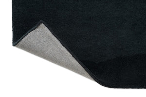 Harlequin Sedimentary Midnight Teppich, Detail von umgeschlagener Ecke und Rücken