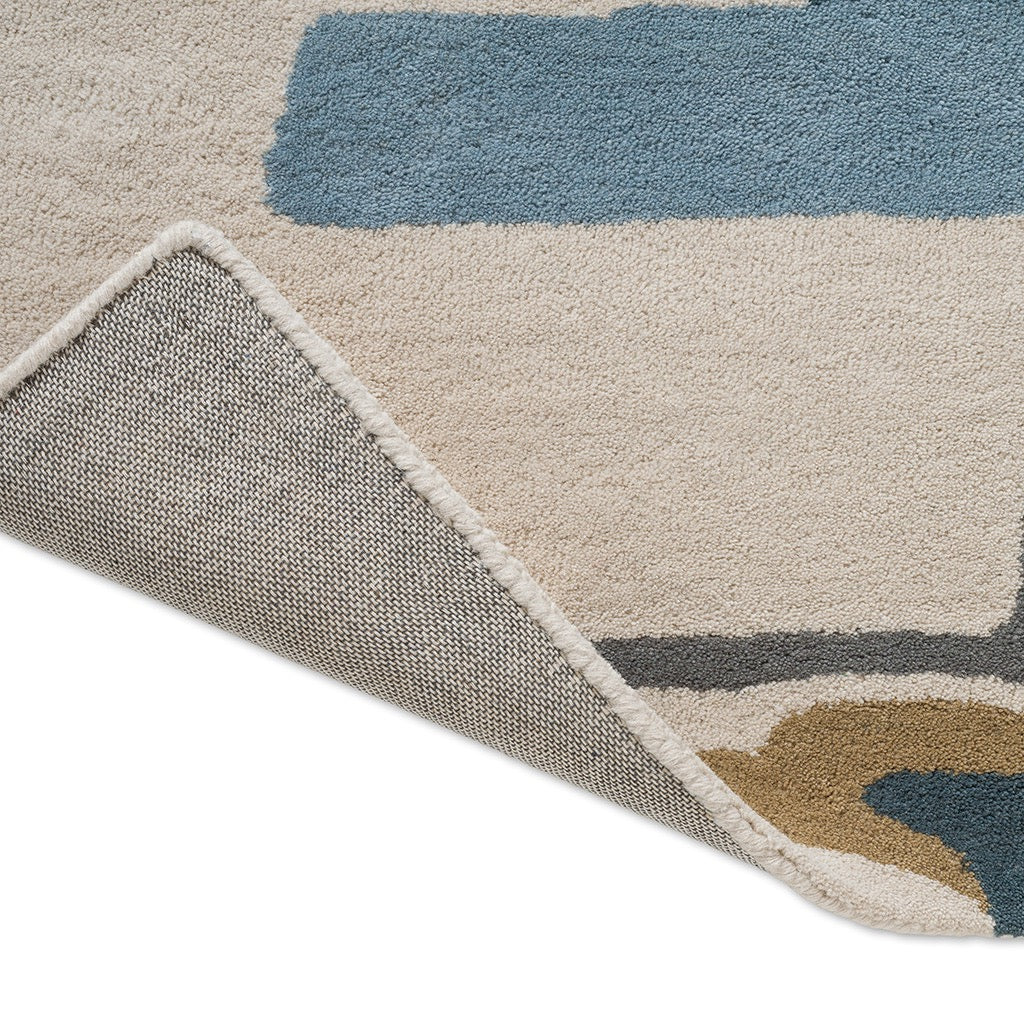Harlequin Zeal Indigo Teppich, Detail von umgeschlagener Ecke und Rücken