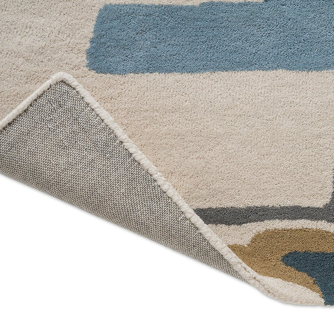 Harlequin Zeal Indigo Teppich, Detail von umgeschlagener Ecke und Rücken