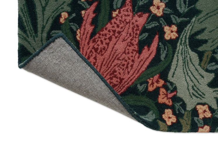 Morris & Co Lent Lily Indigo Madder Teppich, Detail von umgeschlagener Ecke und Rücken