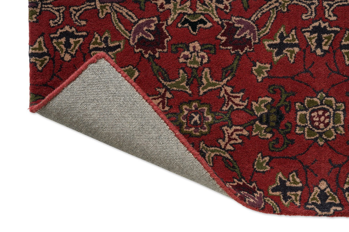 Morris & Co Persian Scroll Plum Teppich, Detail von umgeschlagener Ecke und Rücken