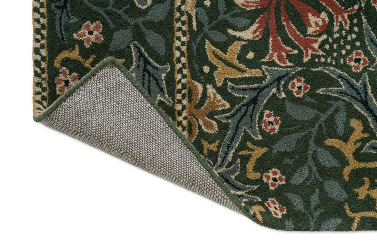 Morris & Co Walthamstow Forest Teal Teppich, Detail von umgeschlagener Ecke und Rücken