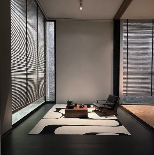 Acsento Swing Black-White Teppich in Schwarz und Creme mit kräftigen runden Formen, im Wohnraum