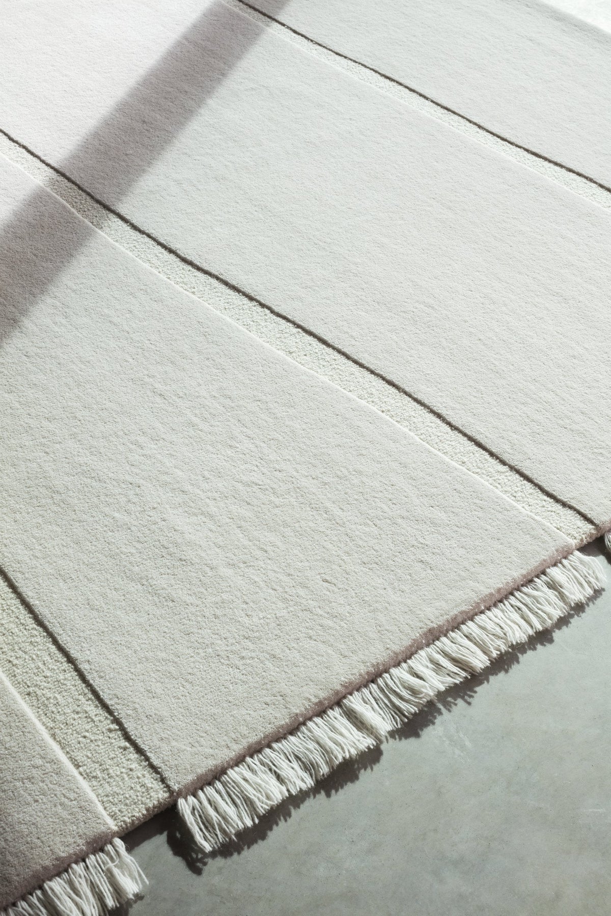 Massimo Atoll Cream cremefarbener Teppich, Detail der Ecke
