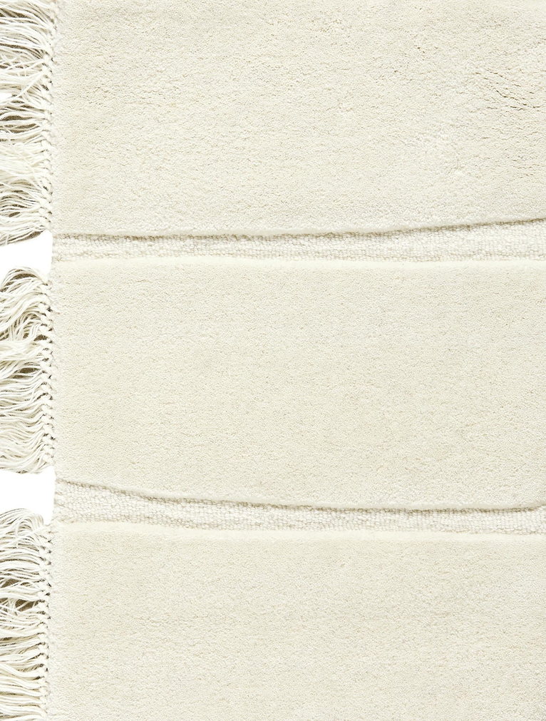 Massimo Atoll Cream cremefarbener Teppich, Detail der Fransen