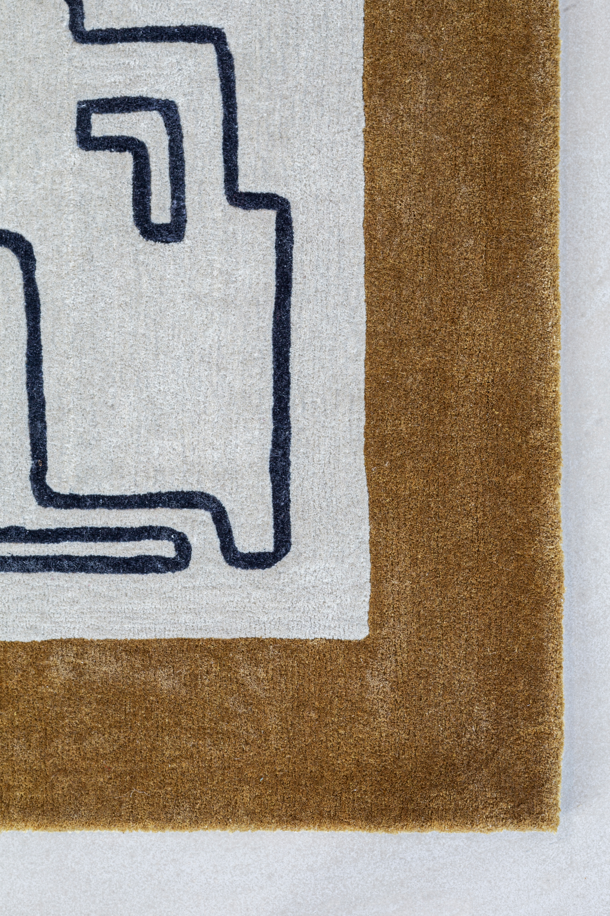 Massimo Structures Border Teppich, Detail der Ecke